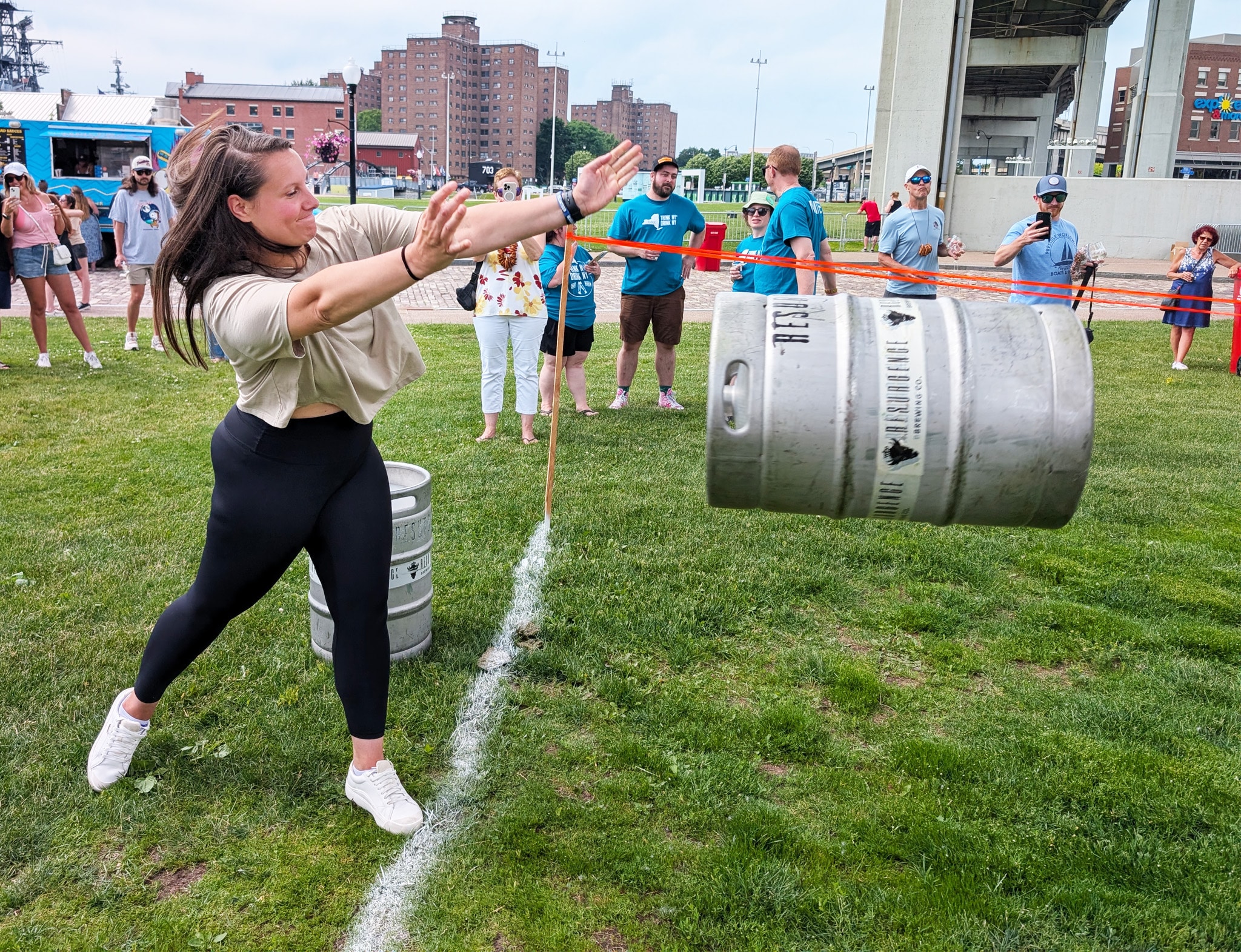 Woman tossing keg of beer